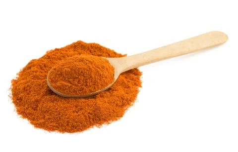 Paprika powder and spoon isolated on white background Stock Photos