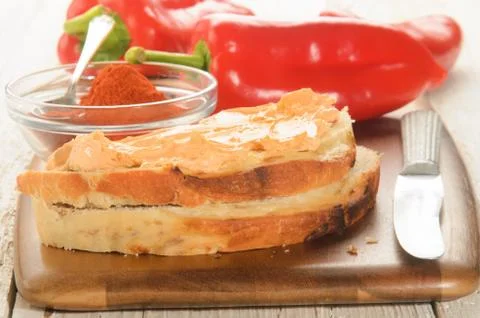 Paprika spread on a slice of bread Stock Photos