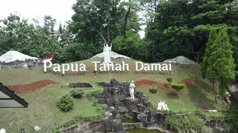 Papua statue of peaceful land on a small hill Stock Footage 213930504