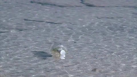 Papyrus message inside the bottle at the sea - stock video Stock Footage 71899813