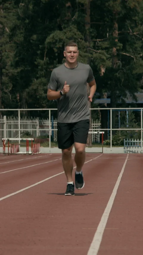 Para Athlete with Disability Jogging at Track and Field Stadium Stock Footage 299113255
