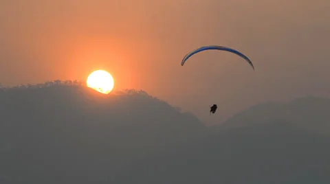 Para glider float over mountain and sunrise (effect) Видео 36369148
