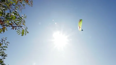 Para glider flying overhead, handheld video Stock Footage 98638945