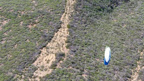 Para-glider over the top of the mountain during summer sunny day Stock Footage 126412720