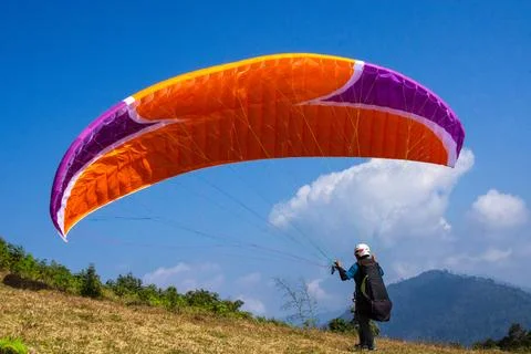 Para glider Preparing for Takeoff Under a Vibrant Blue Sky Stock Photos