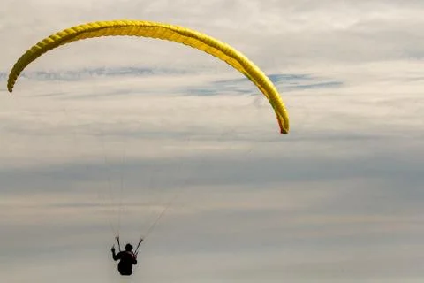A para-glider up in the sky during a fly, surrounded by the clouds Foto stock