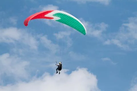 A para-glider up in the sky during a fly, surrounded by the clouds Foto stock