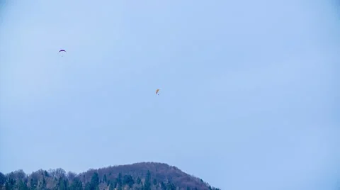 Para-gliders  flaying over the mountains Stock Footage 51019504