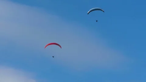 Para Gliders Gliding on Mild Ocean Breeze With Cloudy Sky Stock Footage 77111411
