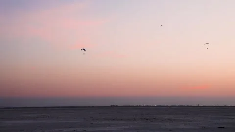 Para motors flying in pristine sunset dramatic orange sky at dusk video is Stock Footage 300668440