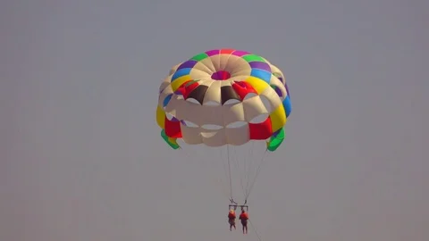 Para-sailing with a multi-coloured parachute 스톡 동영상 78149046