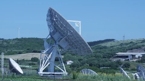 Parabolic Satellite Dish Space Technology Receivers In Countryside With Blue Sky Video stock 85679304