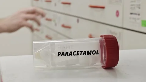PARACETAMOL ACETAMINOPHEN tablets box placed on hospital pharmacy counter Video stock 330507163