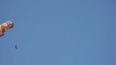 Parachute on a blue sky background Stock Footage 59788676