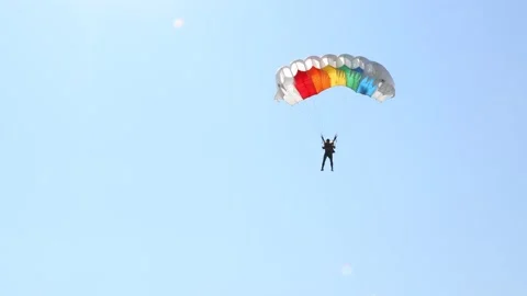 Parachute on the blue sky Stock Footage 162460673