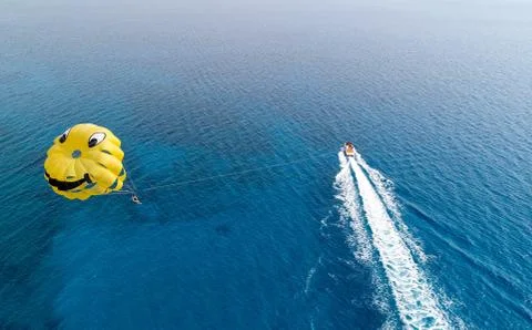 Parachute boat at Cyprus. Summertime fun drone shot Stock Photos