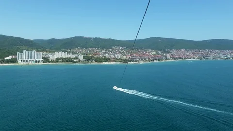 Parachute flight over the coast. Video stock 113398278