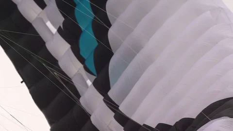 Parachute flying in the sky Stock Footage 77805185