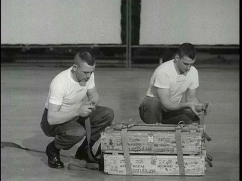 Parachute riggers practice rigging and loading A7 A and A 21 A sling containersƒ Stock Footage 75281903