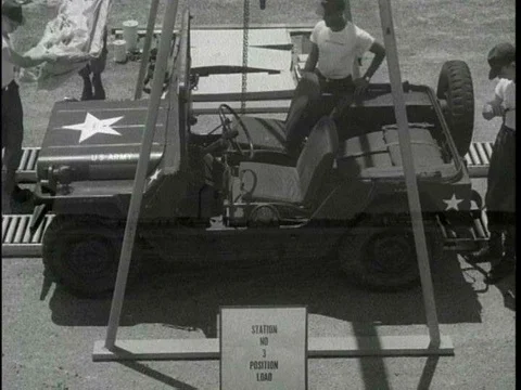 Parachute riggers practice rigging heavy equipment in the 1960s. 스톡 동영상 75281906