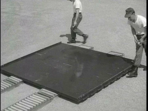 Parachute riggers prepare a modular platform for rigging heavy equipment in theƒ Stock Footage 75281907