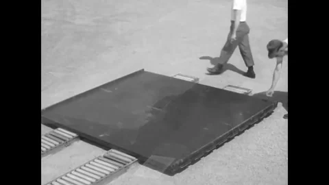 Parachute riggers prepare a modular platform for rigging heavy equipment in the Stock Footage 79429550