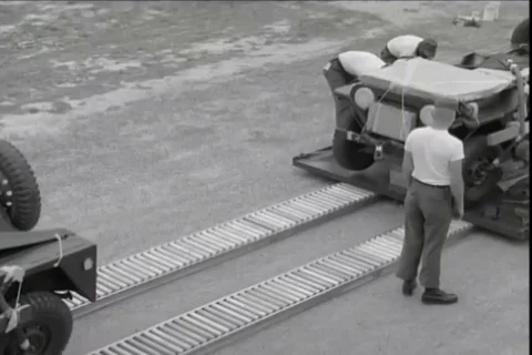 Parachute riggers rigging heavy equipment - 1967 스톡 동영상 118316341