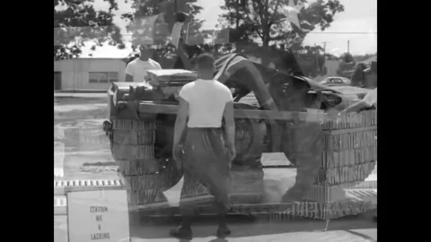 Parachute Rigging students at Fort Benning, Georgia finish rigging a heavy load Video stock 79423937