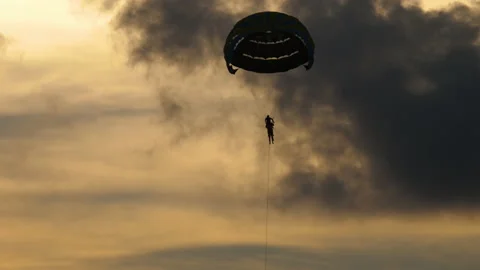 Parachute silhouette in the sky Stock Footage 171830852