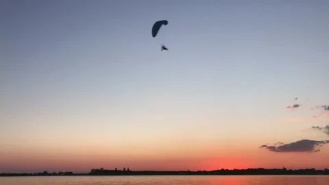Parachute in the sky sunset river  Stock Footage 212407212