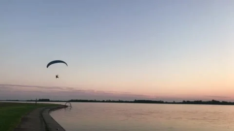 Parachute in the sky sunset river  Stock Footage 212507061