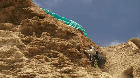 Parachuter climbing after fall Stock Footage 20511171