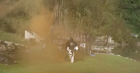Parachuter Lands On Ground Video stock 79730218