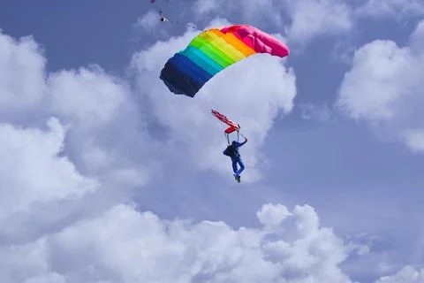 Parachuter over clouds Stock Photos