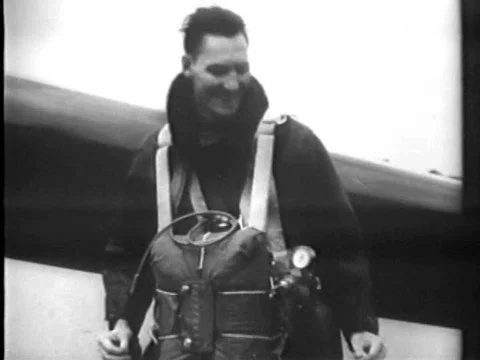 A parachuter parachutes from a record height, above Lancaster, California, in Stock Footage