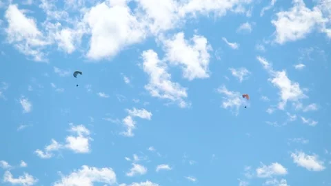 Parachutes in front of the clouds at Manali in Himachal Pradesh, India.  Stock Footage 180506936
