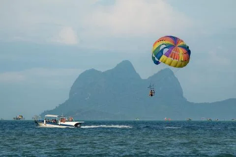 Parachuting behind the boat Stock Photos