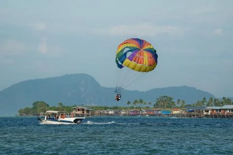 Parachuting behind the boat Stock Photos