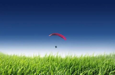 Parachuting in the blue sky Stock Photos
