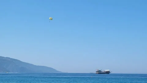 Parachuting in the harbor with ship. Stockbeeldmateriaal 234146282