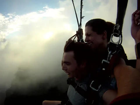 Parachuting over landscape 2 Stock Footage 24673999