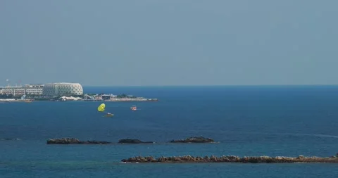 Parachuting In Turkey. Time-lapse Yellow Parasail Wing Pulled By Red Boat. Sea Video stock 253635914