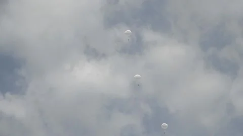 Parachutist on the background of blue sky 動画素材 155540170