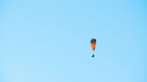 Parachutist on the background of blue sky Stock Footage 168984164