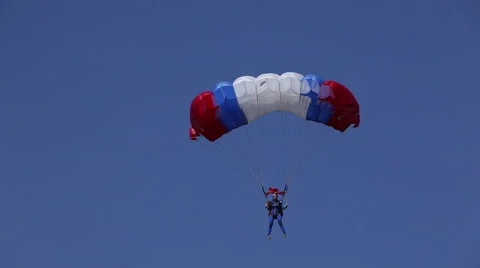 Parachutist in the blue sky Stock Footage 67559391