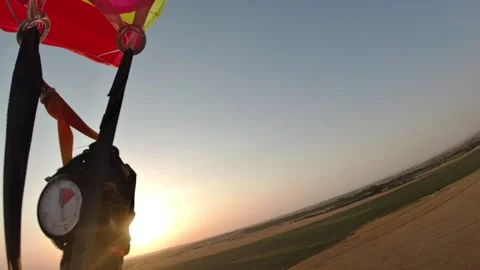 The parachutist controls his flight using parachute straps. Point of View. Stockbeeldmateriaal 314405162