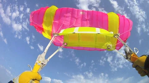 Parachutist falling down and open the parachute and flying Stock Footage