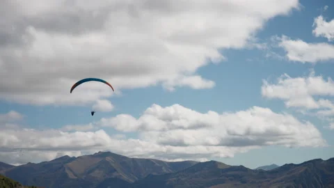 Parachutist is gliding high in the sky Stock Footage 172533334