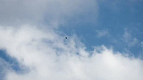 Parachutist gliding through the clouds Stock Footage 172533806