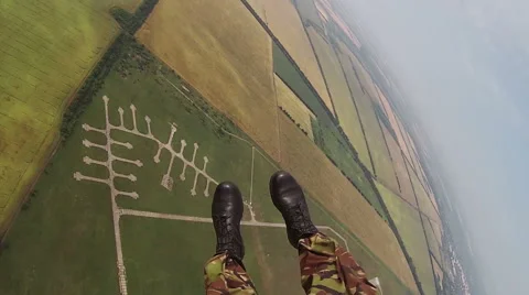 Parachutist jumping out of helicopter with camera attached to his helmet Stock Footage 61863962